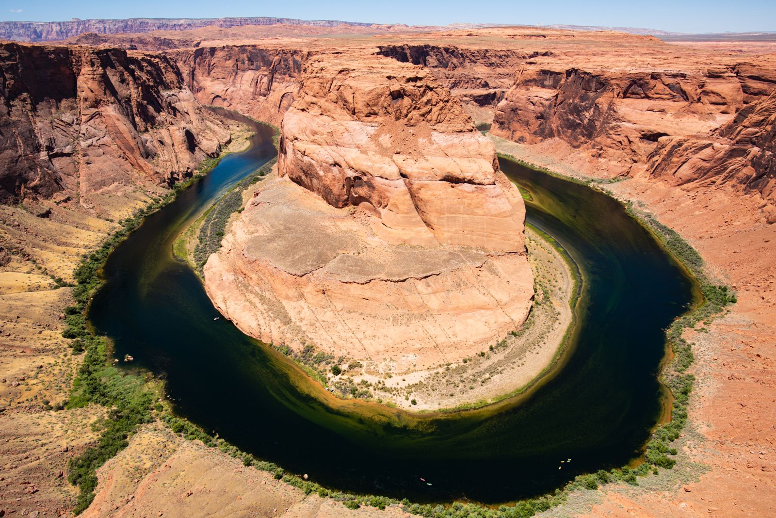 The Colorado River curving around Horseshoe Bend far below the overlook